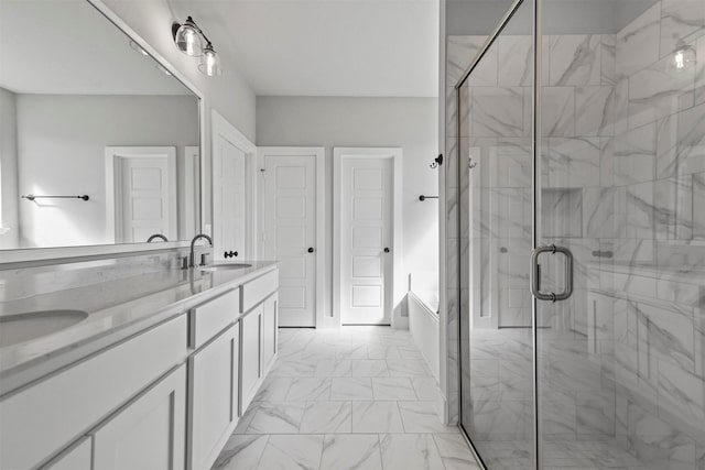 full bath with marble finish floor, a sink, a shower stall, and a bath