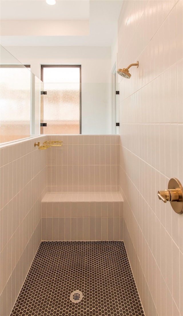 bathroom with a tile shower