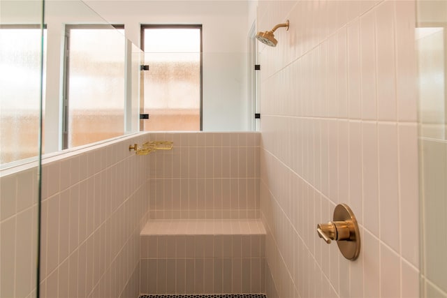 bathroom with tiled shower