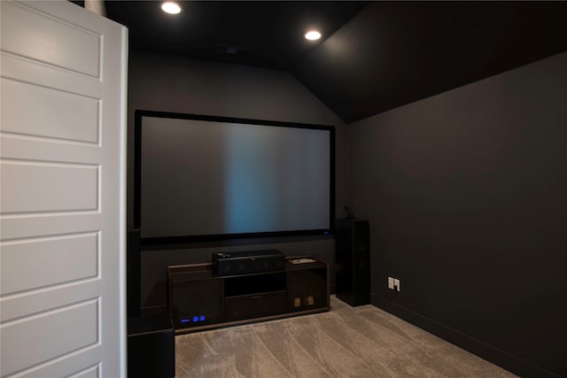 cinema featuring light carpet and lofted ceiling