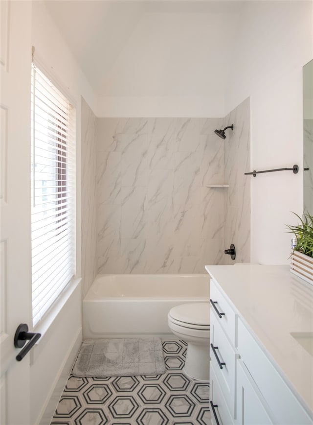 full bathroom with tile floors, plenty of natural light, tiled shower / bath combo, and vanity