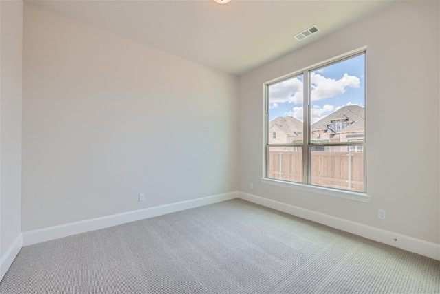 unfurnished room with carpet flooring