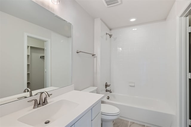 full bathroom with toilet, vanity, tile patterned flooring, and  shower combination