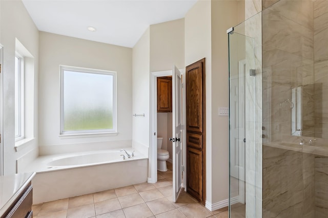 bathroom with tile patterned floors, plus walk in shower, and toilet