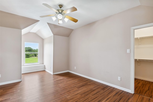 bonus room featuring vaulted ceiling, dark wood-type flooring, and ceiling fan