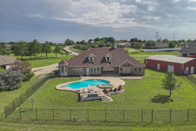 view of pool with a yard and a patio