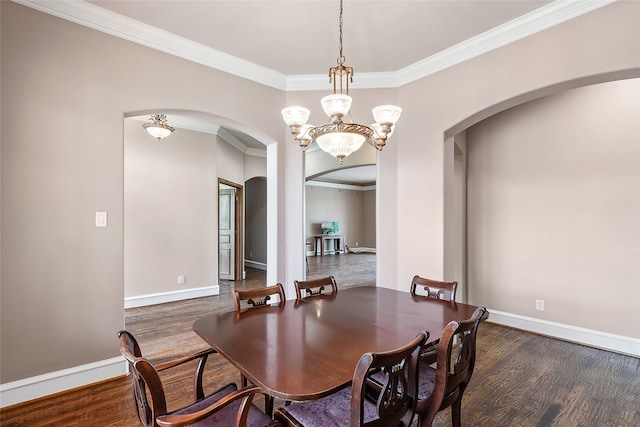 dining room with crown molding, a chandelier, and dark hardwood / wood-style flooring