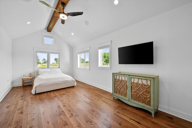 bedroom featuring wood-type flooring, ceiling fan, and multiple windows