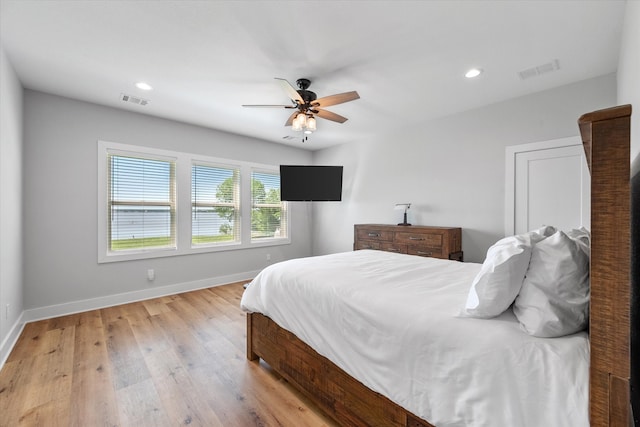 bedroom featuring wood-type flooring and ceiling fan