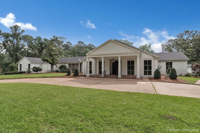 neoclassical / greek revival house with a porch and a front yard