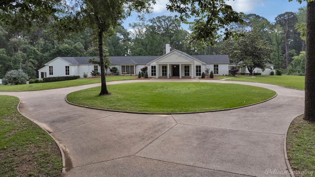 view of front of property with a front lawn