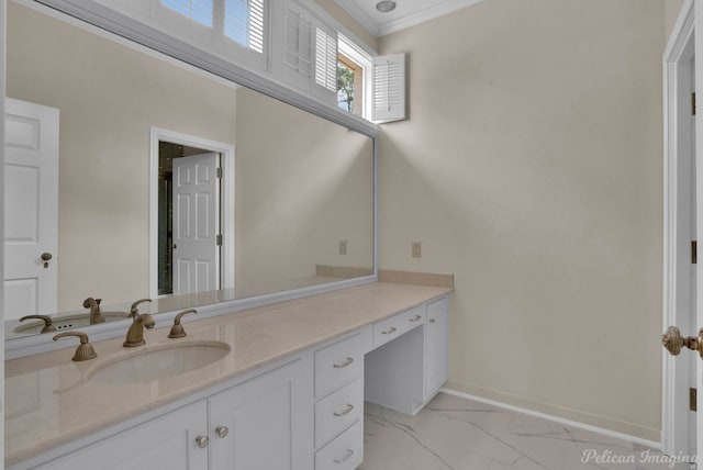 bathroom with crown molding and vanity