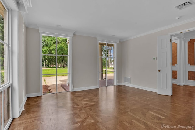 unfurnished room featuring a healthy amount of sunlight, parquet flooring, and ornamental molding