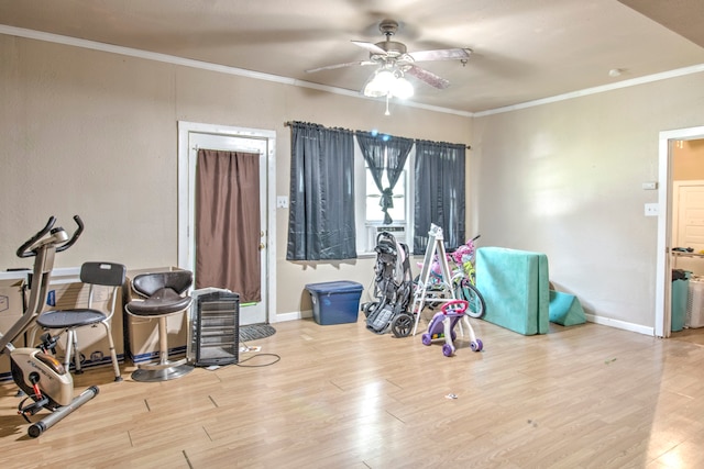 misc room featuring ornamental molding, light wood-type flooring, and ceiling fan