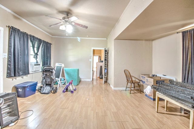 interior space featuring ceiling fan, light hardwood / wood-style flooring, and crown molding