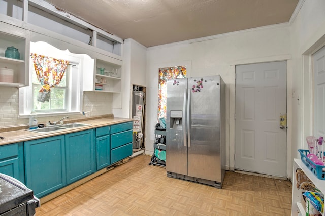 kitchen with stainless steel refrigerator with ice dispenser, blue cabinets, tasteful backsplash, sink, and light parquet flooring