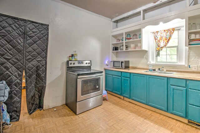 kitchen with appliances with stainless steel finishes, tasteful backsplash, blue cabinetry, and light parquet flooring