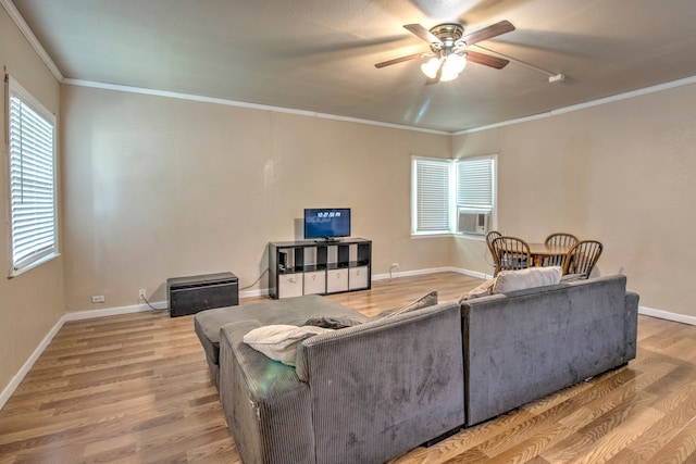 living room with ceiling fan, ornamental molding, and wood-type flooring