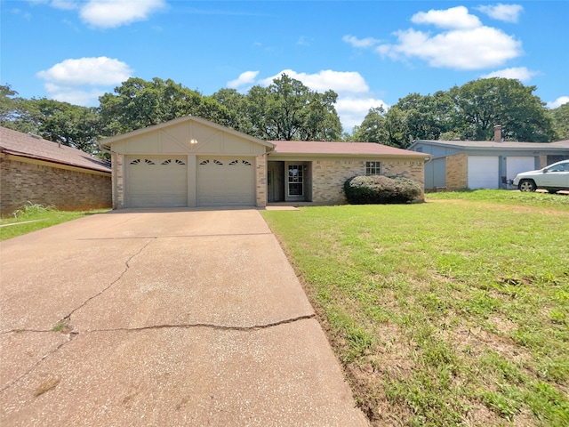 single story home with a garage and a front lawn