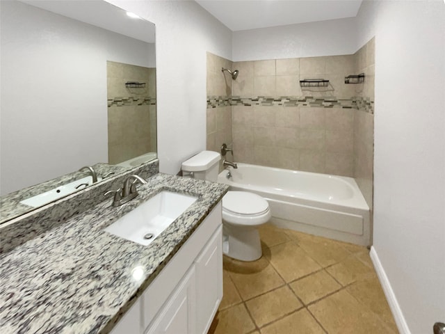 full bathroom featuring tile flooring, tiled shower / bath combo, vanity, and toilet