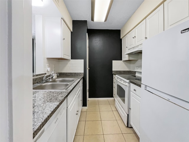 kitchen featuring white appliances, white cabinets, sink, tasteful backsplash, and light tile floors