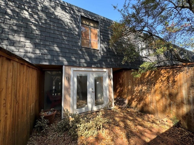 back of property featuring french doors