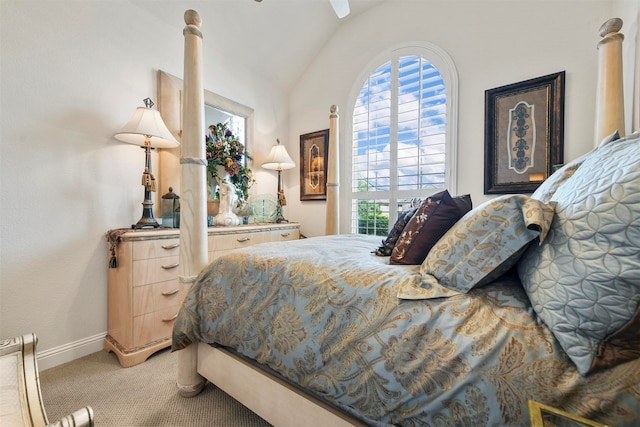 bedroom featuring ceiling fan, lofted ceiling, and light colored carpet