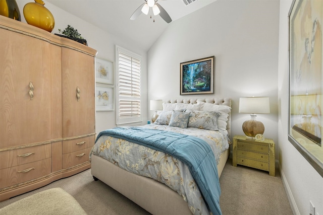 bedroom with lofted ceiling, light colored carpet, and ceiling fan