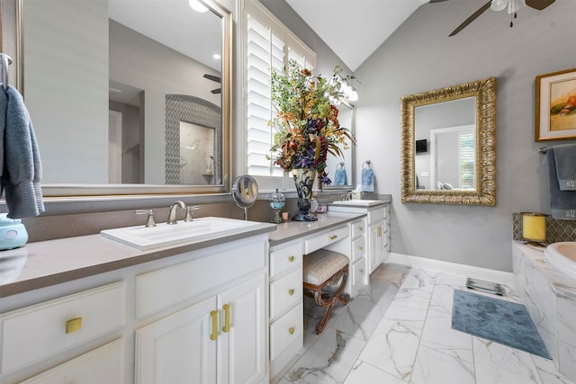 bathroom featuring lofted ceiling, tile patterned floors, ceiling fan, a bath, and double sink vanity