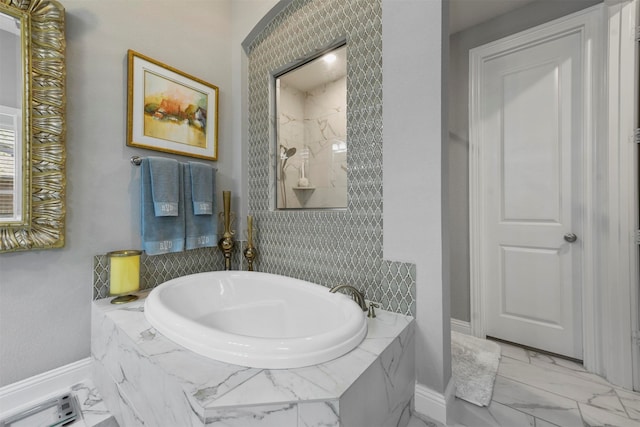 bathroom with tiled bath and tile patterned floors