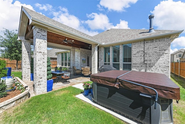 view of patio featuring ceiling fan