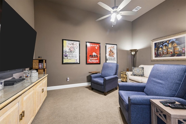 sitting room featuring high vaulted ceiling, light carpet, and ceiling fan