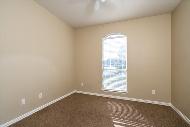 carpeted empty room with ceiling fan