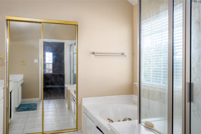 bathroom with plenty of natural light, vanity, and tile floors