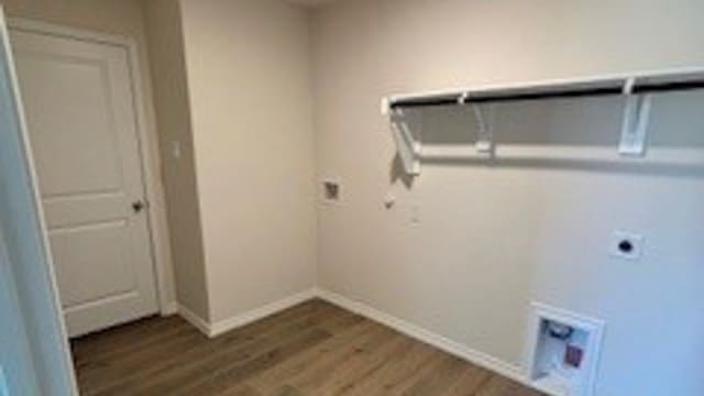 clothes washing area featuring hookup for an electric dryer and hardwood / wood-style floors