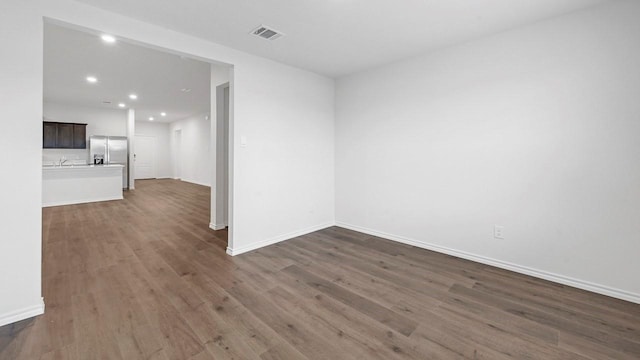 empty room featuring dark hardwood / wood-style flooring