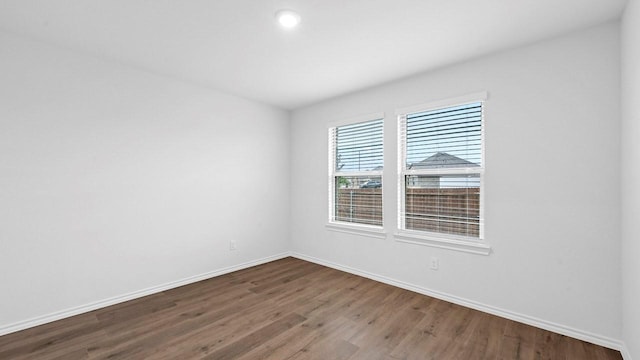 empty room featuring hardwood / wood-style floors