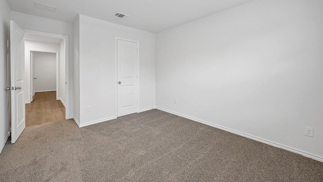 unfurnished bedroom featuring carpet