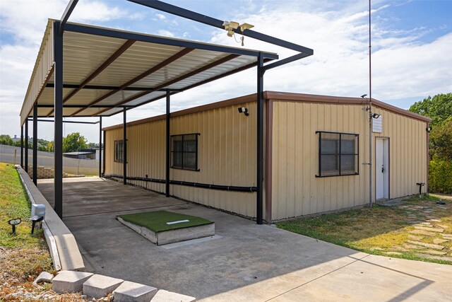 exterior space featuring a carport