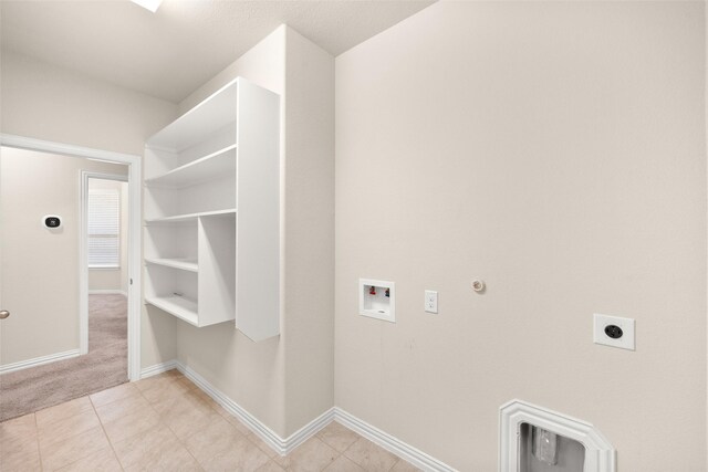 laundry room with gas dryer hookup, hookup for a washing machine, hookup for an electric dryer, and light tile patterned flooring