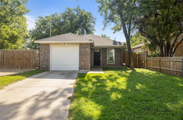 ranch-style house featuring a front yard and a garage