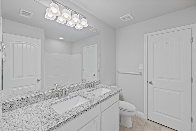 bathroom with tile patterned flooring, a shower, vanity, and toilet