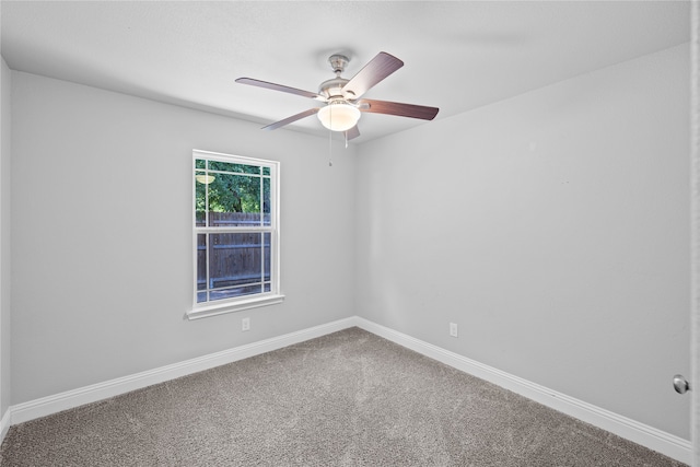 empty room with carpet and ceiling fan