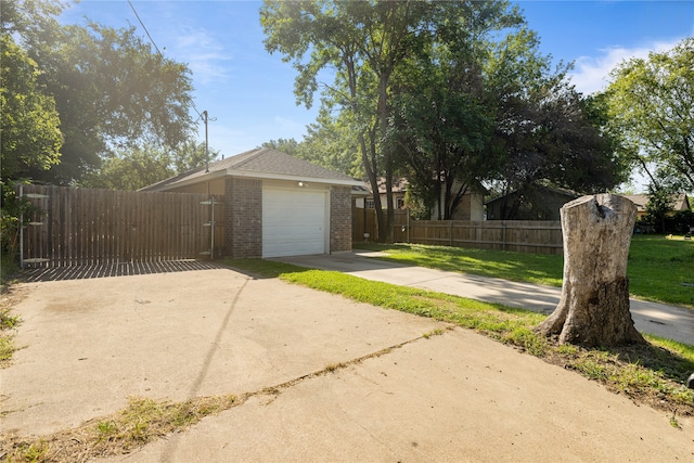 garage featuring a lawn