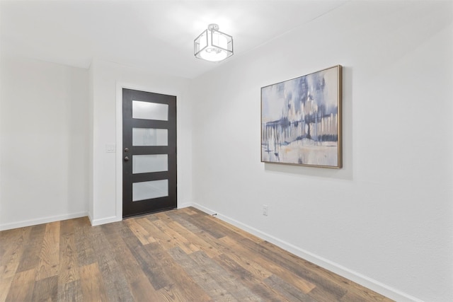 foyer entrance with hardwood / wood-style flooring