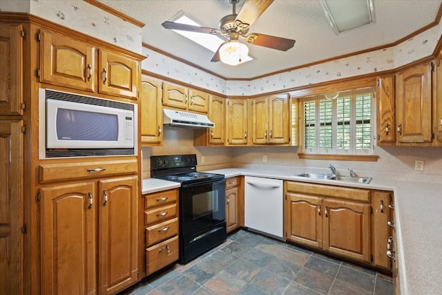 kitchen featuring brown cabinets, under cabinet range hood, a sink, white appliances, and light countertops