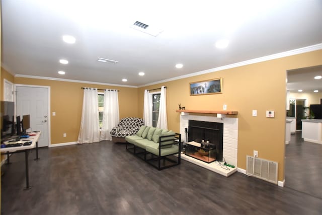 living room with ornamental molding, dark wood-type flooring, and a fireplace