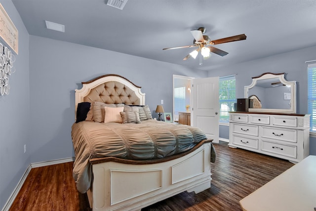 dining space with ceiling fan, hardwood / wood-style floors, and a healthy amount of sunlight