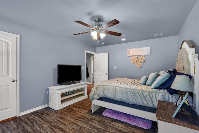 bedroom with ceiling fan and dark wood-type flooring