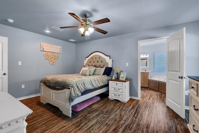 bedroom featuring ensuite bath, ceiling fan, and dark wood-type flooring